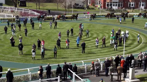 David Davies/Jockey Club Jockeys, owners and trainers marked a two-minute silence in tribute to the duke at Aintree racecourse, Liverpool