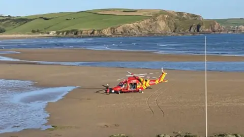 Cornwall Air Ambulance helicopter at Bigbury