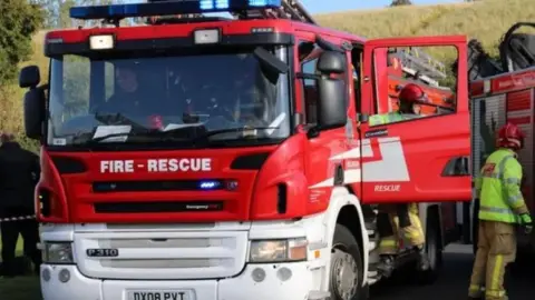 SHROPSHIRE FIRE AND RESCUE SERVICE Fire engine and crew