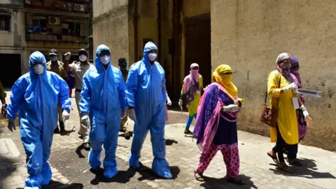 Getty Images Doctors of Indian Medical Association conducted door to door screening camp, during nationwide lockdown due to COVID 19 pandemic at Dharavi, on April 11, 2020 in Mumbai, India.