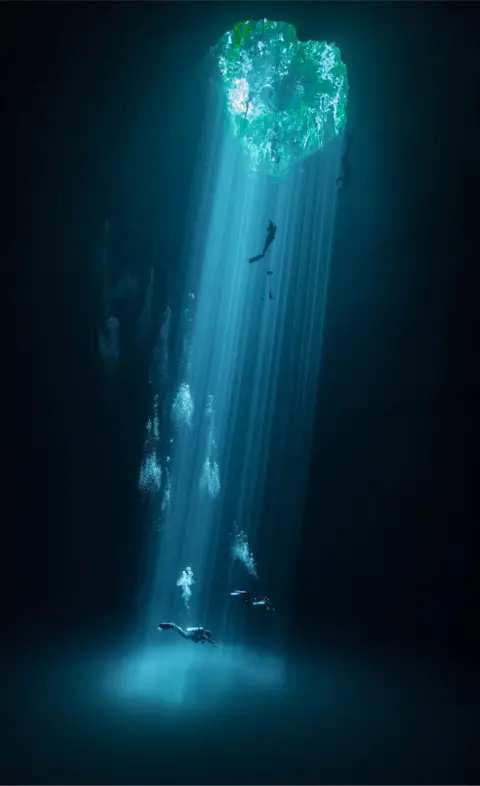 Joram Mennes/TNC Photo Contest 2021 Divers swim in water-filled sinkhole