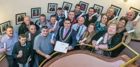 Derek Devoy The volunteers were trained in the mayor's chambers