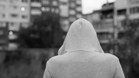 Getty Images Woman in hoodie