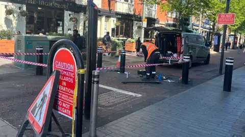 Bollards being repaired in High Street, Leicester city centre