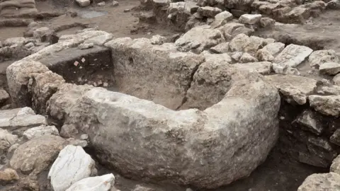 Israeli Antiquities Authority A stone basin that looks similar in shape to a tub