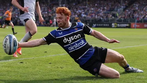 Austin Emens collects the ball to score one of his two tries against Newcastle