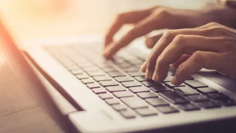 Urupong/Swansea University Fingers typing on a keyboard