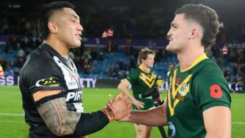 New Zealand's Moses Leota shakes hands with Nathan Cleary of Australia