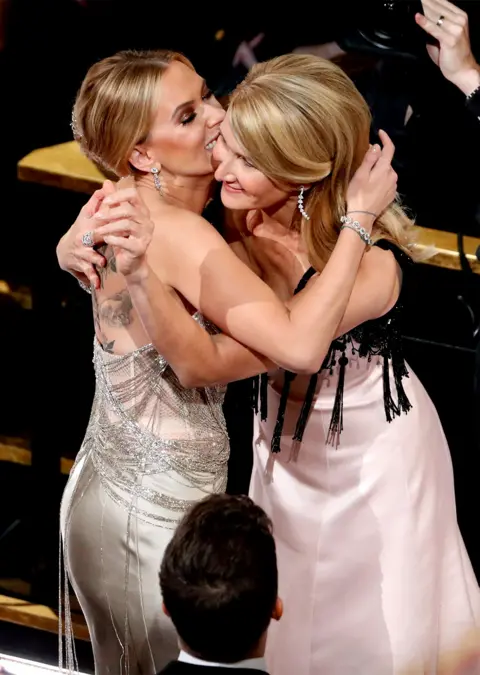 Reuters Scarlett Johansson gives Laura Dern a congratulatory hug