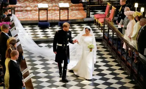 Reuters Prince Harry and Meghan Markle depart from St George's Chapel in Windsor Castle after their wedding