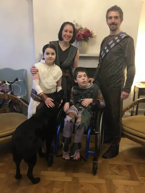 Family handout/PA Media Oliver Voysey with his sister Elizabeth and mum and dad, Sarah and Gary