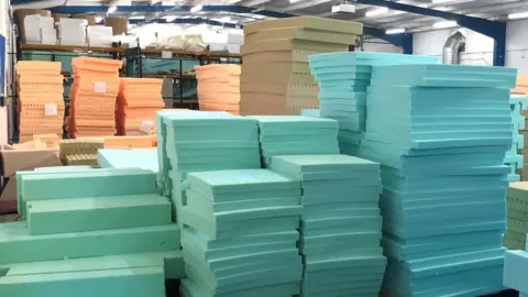 BBC Warehouse full of foam mattresses