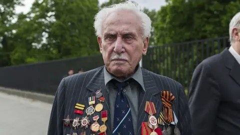 Getty Images David Dushman at a memorial service in Ukraine in 2015