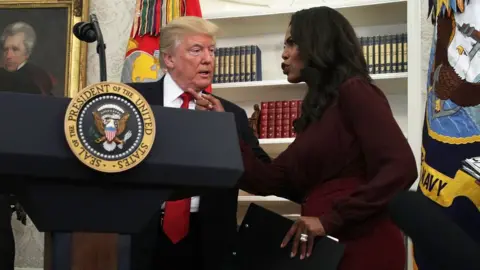 Getty Images Omarosa Manigault talks with Donald Trump in the White House.
