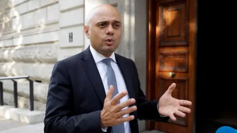 Reuters New Chancellor Sajid Javid outside the Treasury on his first day in the job