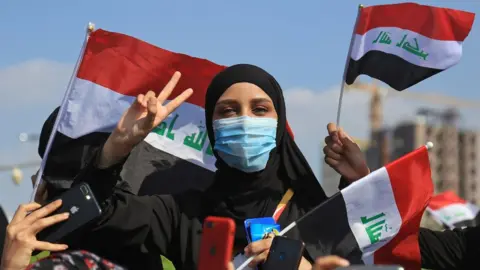 AFP An Iraqi woman takes part in an anti-government protest in the central city of Karbala (31 October 2019)