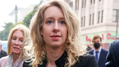 Elizabeth Holmes (C), the founder of the failed blood testing start-up company Theranos, arrives at the Robert F. Peckham Federal Building and US Courthouse for her sentencing hearing in San Jose, California, USA, 18 November 2022