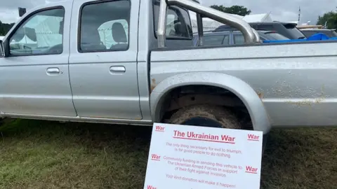 Pickup truck and sign