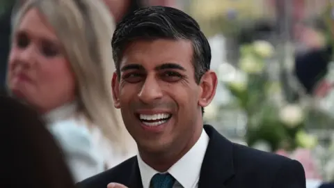 Getty Images Rishi Sunak laughing