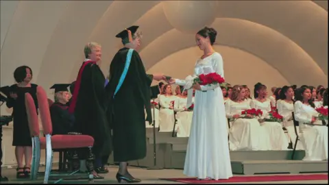 Harry & Meghan/Archewell Productions/Netflix Meghan graduating