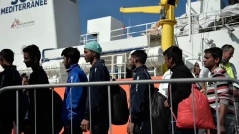 AFP Migrants disembark at the port of Catania, Sicily on May 10, 2018