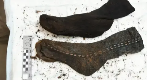 Nottinghamshire Police A pair of odd socks, found at the scene