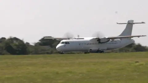 The ATR wet-leased by Aurigny on the runway at Guernsey Airport.