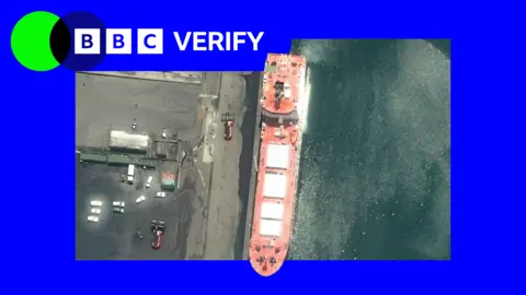 A satellite image of the Pacific Egret, a nuclear fuel carrier sailing under the flag of the United Kingdom. There is blue and green BBC Verify branding in the top left corner.