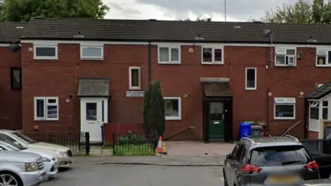 Google Google Streetview of a row of houses on Gateshead Close in the Rusholme area of Manchester.