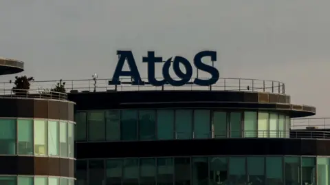 Reuters The logo of French IT consulting firm Atos is seen on a company building 