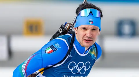 Italian biathlete Tommaso Giacomel before the Olympic biathlon men's 15km mass start 
