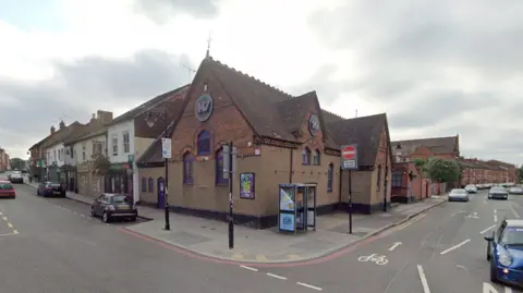 Google A brown rendered and brick building hosting the 147 nightclub