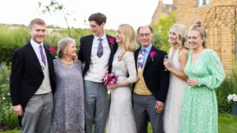 David Best Sarah and David with their children at the eldest daughter's wedding