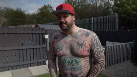 Man covered in tattoos