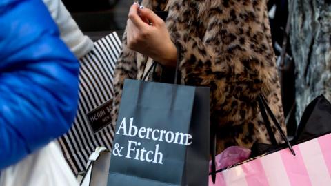 A shopper holds an Abercrombie & Fitch bag in New York, US, in 2016