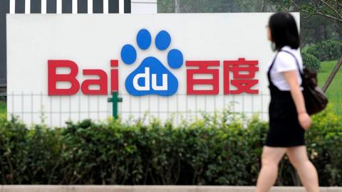 Woman walks in front of Baidu office in China