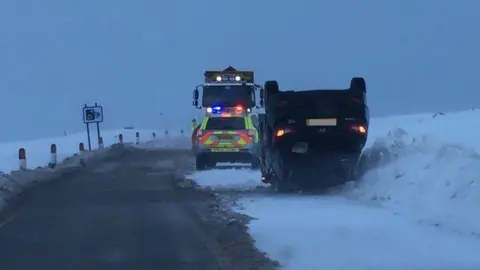 Police Scotland Car on its roof on A82 in the Highlands