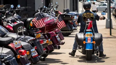 Getty Images A man on a Harley-Davidson motorcycle at a service garage in New York City, 25 June 2018