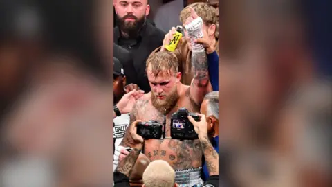 Jake Paul celebrates after winning a fight