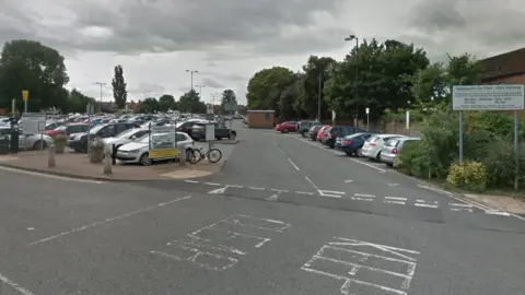 Google Applegarth car park entrance. Several cars are parked in the car park.