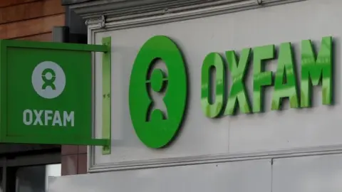 Reuters Oxfam signs