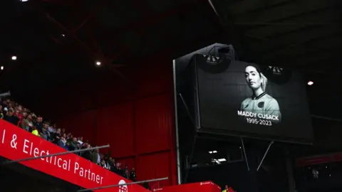 Getty Images A tribute to a Maddy Cusack at a screen at Bramall Lane