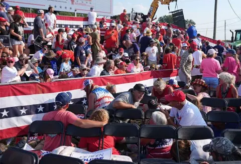 Photo by Jabin Botsford/The Washington Post  Rally attendees on the ground at Butler, Pennsylvania rally 