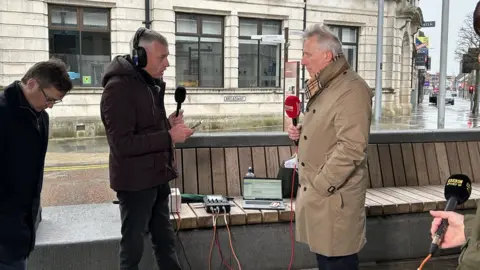 Ian Paisley being interviewed in Ballymena