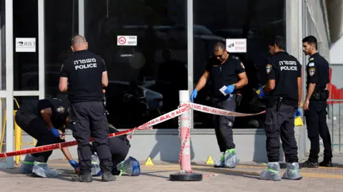 reuters israeli police work at the scene of an attack in beersheba, southern israel, october 6, 2024.