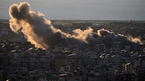 Smoke billows over southern Beirut after an Israeli strike on the Lebanese capital. Photo: 19 October 2024