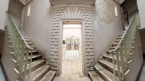 Qays Najm/BBC Two staircases side by side inside the building
