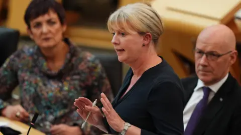 PA Media Finance Secretary Shona Robison gives a Scottish Government Pre-Budget Fiscal Update successful  the Scottish Parliament astatine  Holyrood