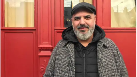 Jacob Phillips Youssef Asri standing outside a shop on Edgware Road