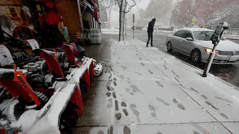 Boston Globe via Getty Images now blowers for sale in a snowy scene Green's Hardware in Wellesley